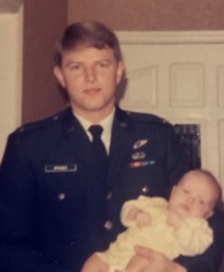 Judge Olita's biological father Lt. Kendall McKinnis holding her when she was a baby