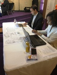 Volunteer attorneys look up criminal histories for clinic attendees.