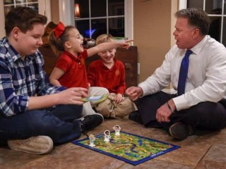 Judge Duane Slone plays Chutes and Ladders with his children, Oakland, 14, left, Estella, 4, and Joseph, 6, on Wednesday, Jan. 18, 2017, at their home in Dandridge, Tenn. (Photo: Lacy Atkins / The Tennessean)