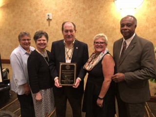 Judge Leon Ruben Award winner Judge Michael F. Mondelli, center, with members of the Ruben family and friend Forrest Garrett