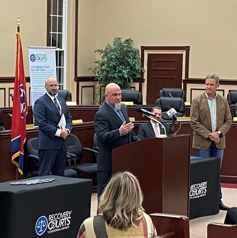 Veterans Treatment Court Graduate Rob Pharris with Judge Gary McKenzie and Governor Bill Lee