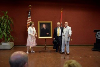 Judge Swann with his wife and John Harber.