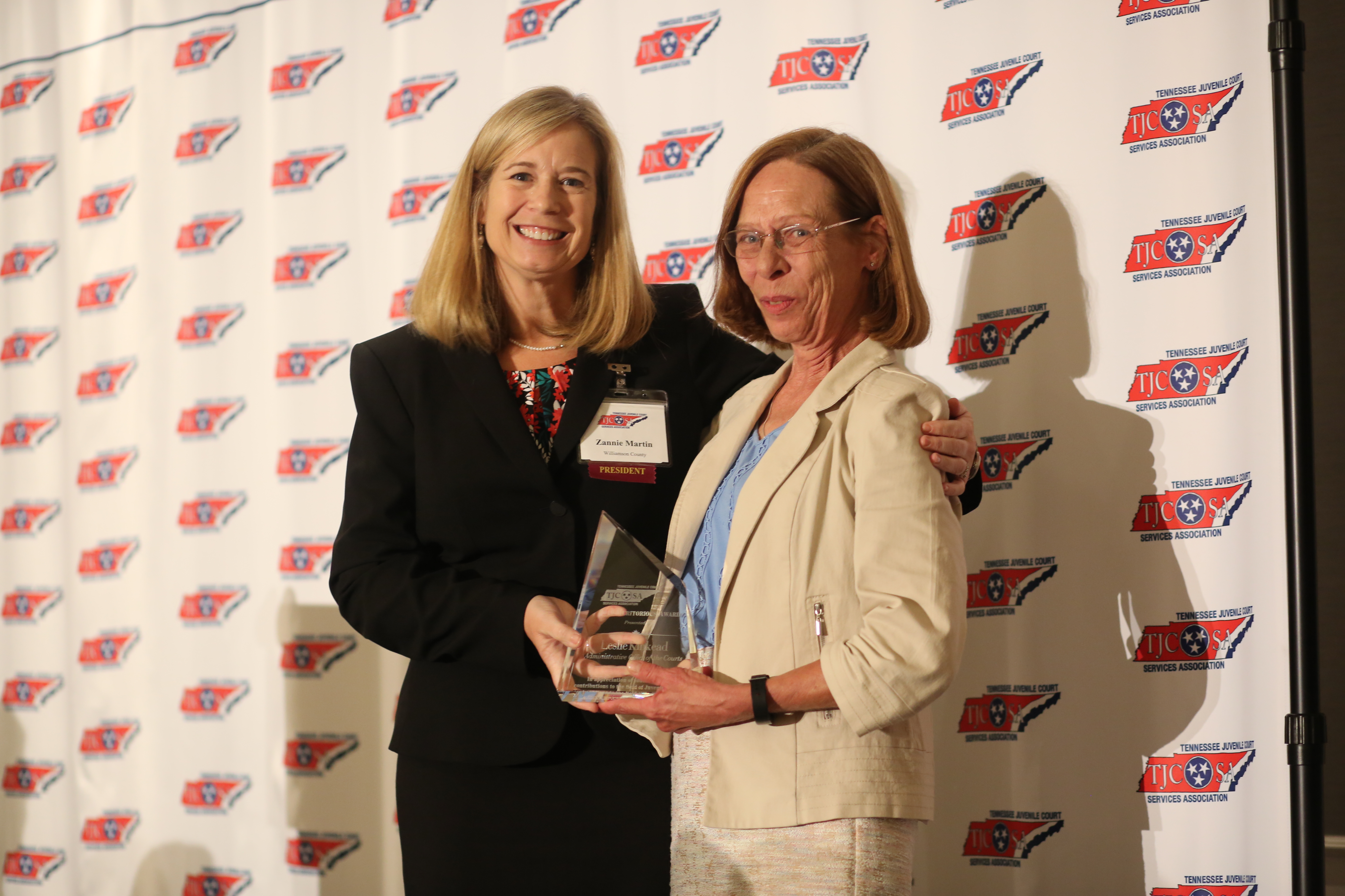 Williamson County Juvenile Services Director Zannie Martin presents the Meritorious Award to Leslie Barrett Kinkead