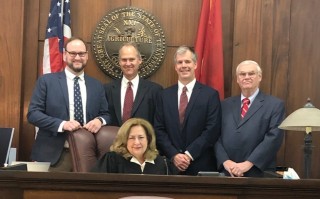 Judge L. Marie Williams pictured with (left to right): Jonathan Cleary, Frank Williams, James Williams, and Jeff Cleary.