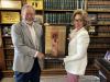 CCA Judges Robert Wedemeyer and Camille McMullen holding the presiding judge infinity/eternity plaque